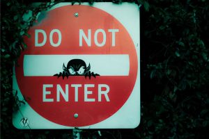 Do not enter sign with a devil peering
