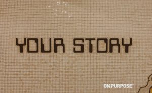Tile mosaic image with the word "YOUR STORY" embedded in the tiles.